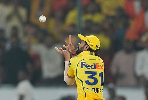 Chennai Super Kings' captain Ruturaj Gaikwad takes the catch to dismiss Sunrisers Hyderabad's captain Ishan Kishan during the Indian Premier League cricket match between Sunrisers Hyderabad and Chennai Super Kings in Hyderabad.