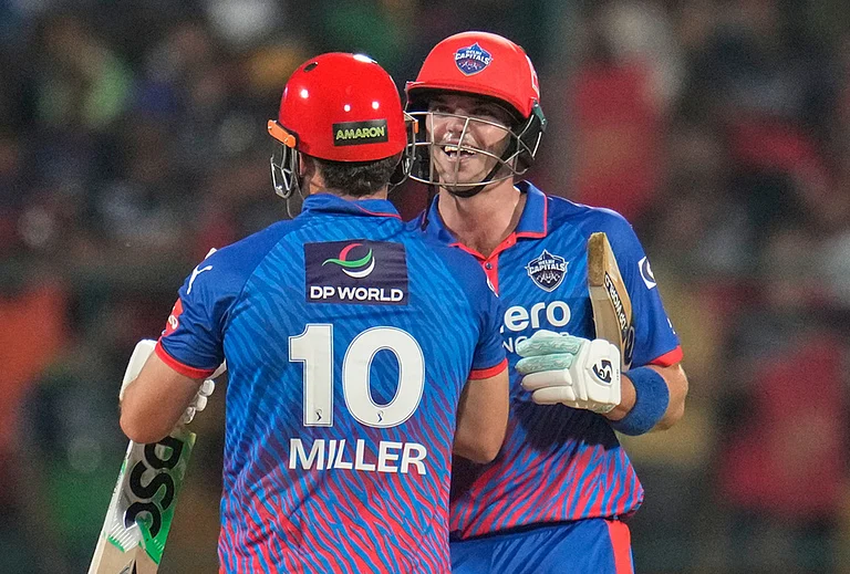 Delhi Capitals' Tristan Stubbs and David Miller celebrate their win in the Indian Premier League cricket match between Royal Challengers Bengaluru and Delhi Capitals in Bengaluru. - | Photo: AP/Aijaz Rahi