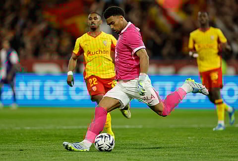 Toulouse's goalkeeper Guillaume Restes clears the ball during a League One soccer match between Lens and Toulouse in Lens, France.