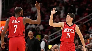 | Photo: AP/Karen Warren : Houston Rockets' Kevin Durant (7) high-fives Reed Sheppard (15) after Sheppard's 3-point basket during the first half of an NBA basketball game against the Utah Jazz, in Houston.