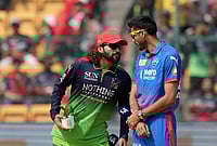 | Photo: PTI/Shailendra Bhojak : Royal Challengers Bengaluru's captain Rajat Patidar, left, and Delhi Capitals' captain Axar Patel during the toss before an Indian Premier League (IPL) 2026 T20 cricket match between Royal Challengers Bengaluru and Delhi Capitals, in Bengaluru, Karnataka.