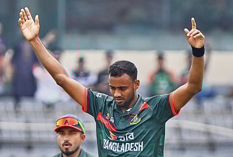 Bangladesh's Shoriful Isalm celebrates the wicket of New Zealand's Nick Kelly during the first one day international cricket match between Bangladesh and New Zealand in Mirpur, Bangladesh.