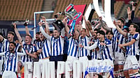 Atletico Madrid Vs Real Sociedad, Copa Del Rey Final: La Real Claim Fourth Title With Penalty Shootout Win (AP Photo/Jose Breton) : Real Sociedad's team players celebrate with the trophy after the Copa del Rey final soccer match between Atletico Madrid and Real Sociedad in Seville, Spain, early Sunday, April. 19, 2026.