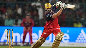 | Photo: AP/Aijaz Rahi : Royal Challengers Bengaluru's Tim David plays a shot during the Indian Premier League cricket match between Royal Challengers Bengaluru and Lucknow Super Giants in Bengaluru, India.