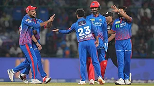 | Photo: AP/Manish Swarup : Delhi Capitals' Kuldeep Yadav, centre, celebrates with teammates the wicket of Gujarat Titans' Jos Buttler during the Indian Premier League cricket match between Delhi Capitals and Gujarat Titans in New Delhi.