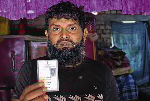 Mehbub Alam (in black) and Afajul Hoque were told their names were excluded because their fathers had six children. Both are from Milangarh in Malda and work as daily wagers in Kerala. 