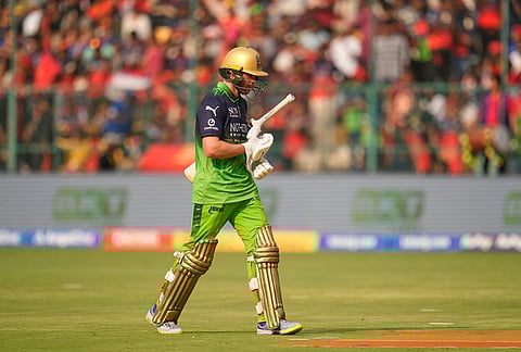 Royal Challengers Bengaluru's Phil Salt walks off the filed after losing his wicket during the Indian Premier League cricket match between Royal Challengers Bengaluru and Delhi Capitals in Bengaluru.
