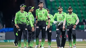 Photo: thepslt20/X : Lahore Qalandars' players celebrating a wicket of Multan Sultans during a PSL 2026 clash at Gaddafi Stadium in Lahore.