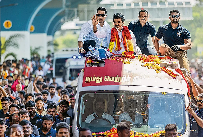 Taking on the Dravidian Majors: Actor-turned-politician Vijay at an election roadshow in Tiruppur on April 14, 2026 - | Photo: PTI