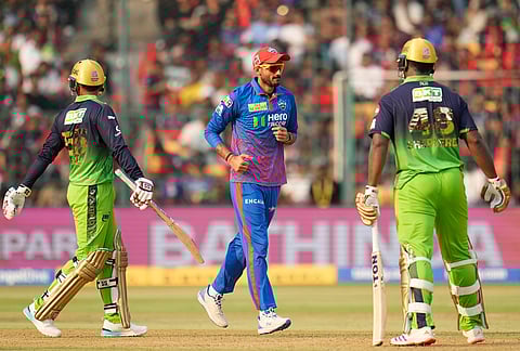 Delhi Capitals' captain Axar Patel celebrates the dismissal of Royal Challengers Bengaluru's Romario Shepherd during the Indian Premier League cricket match between Royal Challengers Bengaluru and Delhi Capitals in Bengaluru.