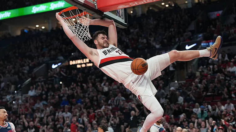Portland Trail Blazers center Donovan Clingan dunks during the first half of an NBA basketball game against the Los Angeles Clippers, Friday, April 10, 2026, in Portland, Ore. - AP Photo