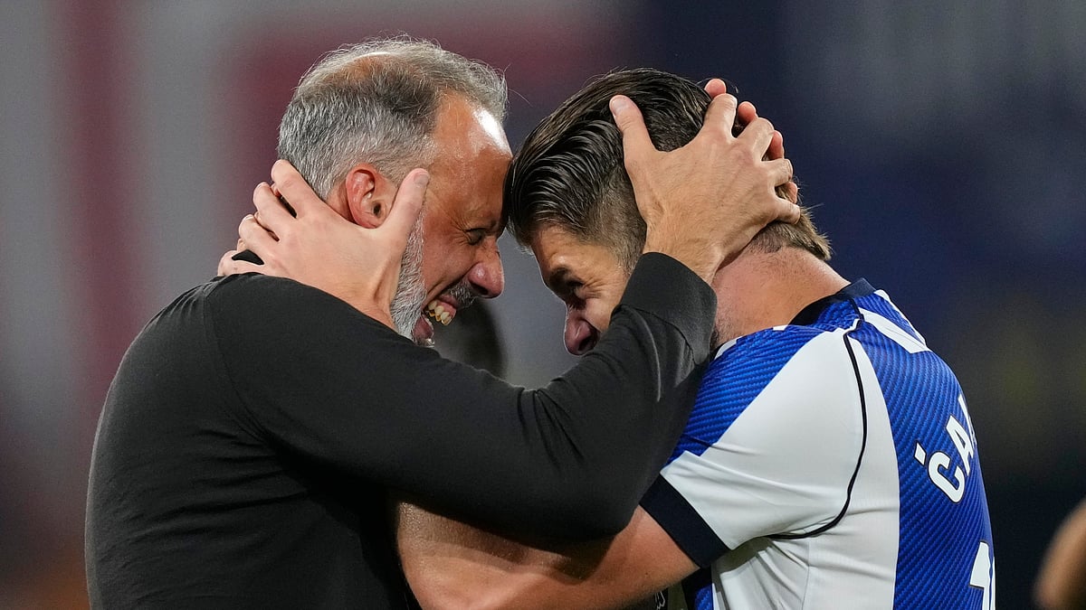 Real Sociedad's head coach Pellegrino Matarazzo, right, celebrates with Duje Caleta-Car after winning the Copa del Rey final soccer match between Atletico Madrid and Real Sociedad in Seville, Spain, Saturday, April. 18, 2026. - (AP Photo/Jose Breton)