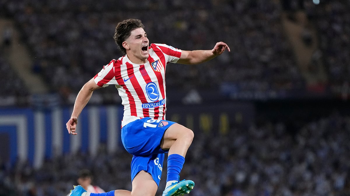 Atletico Madrid's Julian Alvarez celebrates after scoring his side's second goal during the Copa del Rey final soccer match between Atletico Madrid and Real Sociedad in Seville, Spain, Saturday, April. 18, 2026. - (AP Photo/Jose Breton)