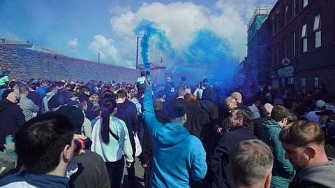 Fans arrive at the Hill Dickinson Stadium prior to the English Premier League soccer match between Everton and Liverpool in Liverpool, England, Sunday, April 19, 2026.