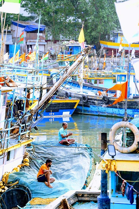 Anchored boats and waiting hands—Sassoon Dock captures the pause before the next catch.