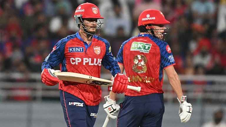 Cooper Connolly, right, and his batting partner Priyansh Arya run between the wickets during the Indian Premier League match between Punjab Kings and Lucknow Super Giants in New Chandigarh. - AP