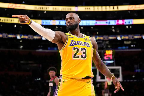 Los Angeles Lakers forward LeBron James gestures after scoring during the second half in Game 1 of a first-round NBA playoffs basketball series against the Houston Rockets in Los Angeles.