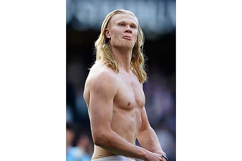 Manchester City's Erling Haaland celebrates at the end of the English Premier League soccer match between Manchester City and and Arsenal, in Manchester, England.