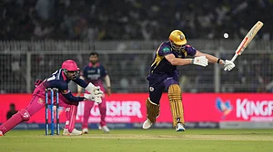 AP/Bikas Das : Rajasthan Royals' Dhruv Jurel, left, collects the ball before stumping Kolkata Knight Riders' Cameron Green, right, out during their Indian Premier League match in Kolkata.