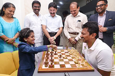 In this image posted on April 18, 2026, Tamil Nadu Deputy Chief Minister Udhayanidhi Stalin plays a game of chess with player AS Sharvaanica following her victory at the FIDE Under-12 World Rapid Championship, in Chennai.