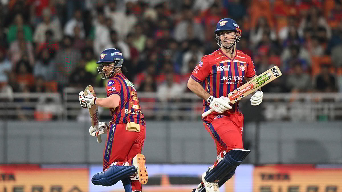Lucknow Super Giants' Mitchell Marsh, right, and his batting partner Ayush Badoni run between the wickets during the Indian Premier League cricket match between Punjab Kings and Lucknow Super Giants in New Chandigarh, India, Sunday, April 19, 2026. - (AP Photo)