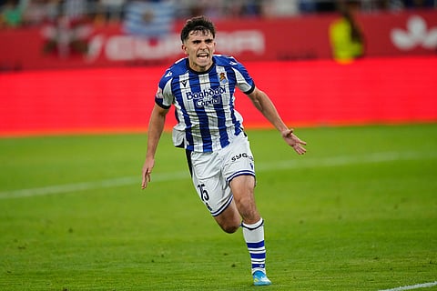 Real Sociedad's Pablo Marin celebrates after scoring a penalty during the penalty shoot out at the Copa del Rey final soccer match between Atletico Madrid and Real Sociedad in Seville, Spain.
