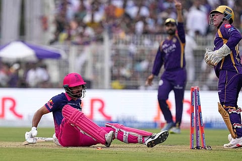 Rajasthan Royals' Dhruv Jurel is on the ground after getting stumped out by Kolkata Knight Riders' Tim Seifert, right, during the Indian Premier League cricket match between Kolkata Knight Riders and Rajasthan Royals in Kolkata, India.