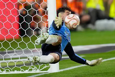 Real Sociedad's goalkeeper Unai Marrero makes a save during during the penalty shoot out at the Copa del Rey final soccer match between Atletico Madrid and Real Sociedad in Seville, Spain.