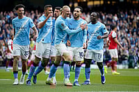 | Photo: AP/Dave Thompson : Manchester City's Rayan Cherki celebrates with his teammates after scoring his side's first goal during the English Premier League soccer match between Manchester City and and Arsenal, in Manchester, England.