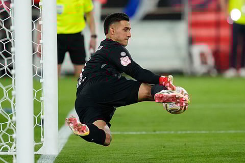 Atletico Madrid's goalkeeper Juan Musso makes a save during during the penalty shoot out at the Copa del Rey final soccer match between Atletico Madrid and Real Sociedad in Seville, Spain.