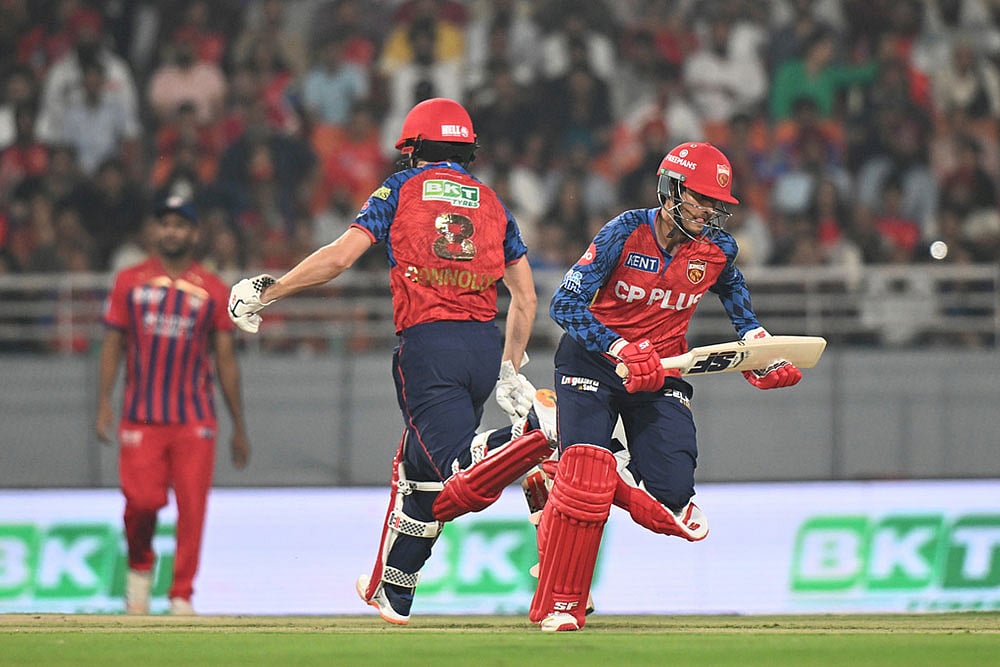 Punjab Kings' Priyansh Arya, right, and his batting partner Cooper Connolly run between the wickets during the Indian Premier League cricket match between Punjab Kings and Lucknow Super Giants in New Chandigarh, India. - | Photo: AP