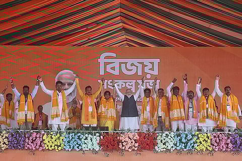 In this image released on April 19, 2026, Prime Minister Narendra Modi, centre, during a public meeting ahead of West Bengal Assembly elections, in Bishnupur, West Bengal.