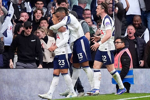 Tottenham Hotspur's Pedro Porro, left, celebrates scoring their side's first goal of the game during their English Premier League soccer match against Brighton & Hove Albion in London.
