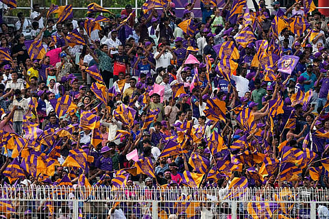 Kolkata Knight Riders fans cheer for their team during the Indian Premier League cricket match between Kolkata Knight Riders and Rajasthan Royals in Kolkata, India.