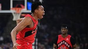 AP Photo : Toronto Raptors forward Scottie Barnes reacts after a foul was not called in his favor during the first half in Game 1 of a first-round NBA playoff basketball series against the Cleveland Cavaliers.