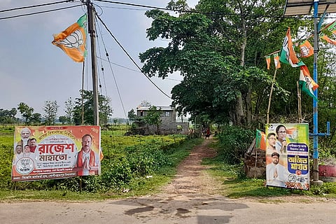 In this image received on April 19, 2026, election posters and flags of political parties line a village road in the Gopiballavpur Assembly segment ahead of the West Bengal Assembly elections, in Jhargram, West Bengal.