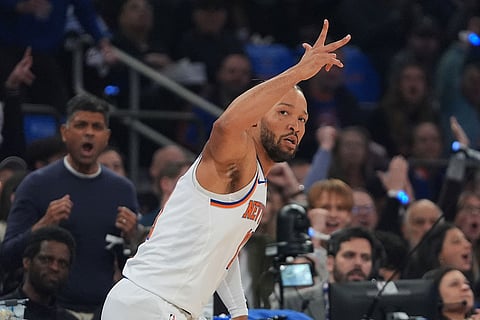 New York Knicks' Jalen Brunson (11) gestures after making a three-point shot during the first half in Game 1 of a first-round NBA playoffs basketball series against the Atlanta Hawks  in New York.