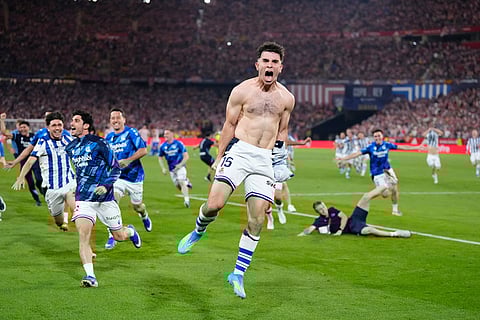 Real Sociedad's Pablo Marin, centre, celebrates with teammates as they won the Copa del Rey final soccer match between Atletico Madrid and Real Sociedad in Seville, Spain.