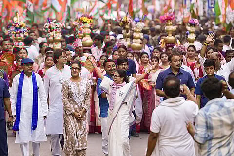 West Bengal Chief Minister Mamata Banerjee takes part in a roadshow rally ahead of the Assembly elections, in Howrah, West Bengal.