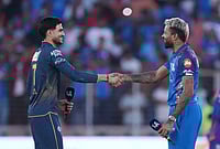 | Photo: AP/Ajit Solanki : Gujarat Titans' captain Shubman Gill, left, shake hands with Mumbai Indians' captain Hardik Pandya after the toss before the start the Indian Premier League cricket match between Gujarat Titans and Mumbai Indians in Ahmedabad.
