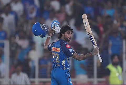 Mumbai Indians' Tilak Verma celebrates his century during the Indian Premier League cricket match between Gujarat Titans and Mumbai Indians in Ahmedabad.