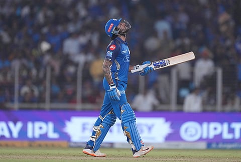 Mumbai Indians' Tilak Verma celebrates his fifty runs during the Indian Premier League cricket match between Gujarat Titans and Mumbai Indians in Ahmedabad.