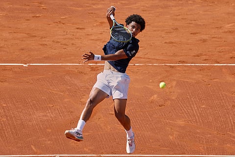 France's Arthur Fils returns the ball to Russia's Andrey Rublev during the ATP Barcelona Open tennis final in Barcelona, Spain.