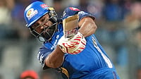 AP/Rafiq Maqbool : Rohit Sharma plays a shot during the Indian Premier League match between Mumbai Indians and Royal Challengers Bengaluru, in Mumbai.