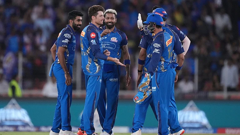 Mitchell Santner, second from left, celebrates with teammates the wicket of Washington Sundar during the Indian Premier League match between Gujarat Titans and Mumbai Indians in Ahmedabad. - AP/Ajit Solanki