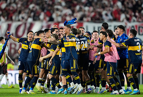 Players of Boca Juniors celebrate defeating River Plate in an Argentine soccer league match in Buenos Aires, Argentina.