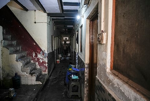 A single three-story building in Khoda village can have as many as 15 single rooms occupied by individual families. The rooms are small and windowless, and the residents make do with only two toilets in the building.