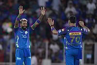 GT Vs MI, IPL 2026: Tilak's Century, Ashwani's Four-Fer Help Mumbai Indians Secure Much-Needed Win | Photo: AP/Ajit Solanki : Mumbai Indians' captain Hardik Pandya, left, celebrates after winning the match the Indian Premier League cricket match against Gujarat Titans in Ahmedabad.