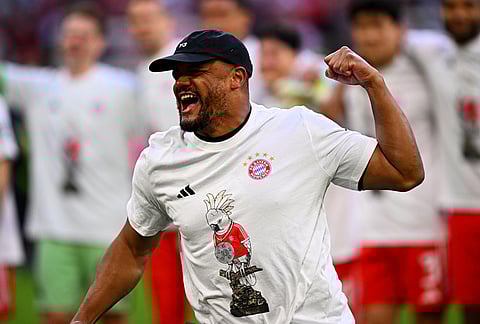 Bayern's coach Vincent Kompany celebrates after winning the German championship at the end of the Bundesliga soccer match between Bayern and Stuttgart in Munich, Germany.