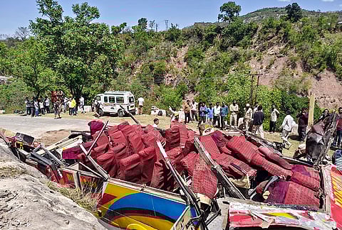 Wrecked remains of a passenger bus after it rolled down a hill, in Jammu and Kashmir’s Udhampur district, Monday, April 20, 2026. At least 15 people were killed and 20 others injured in the incident. 